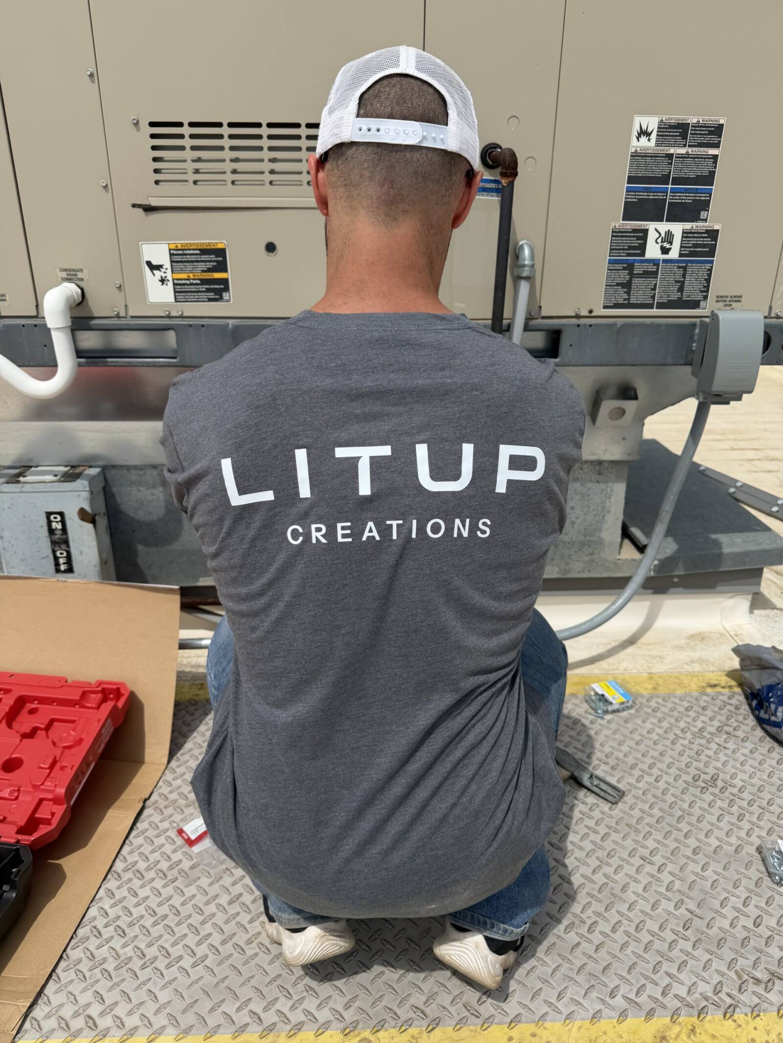 our team installing commercial permanent lighting